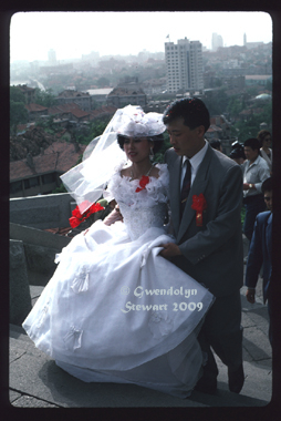 Bride and 
Groom, The Bell Tower, Qingdao, China, 1994, Photographed by Gwendolyn 
Stewart c. 2009; All Rights Reserved