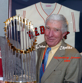 Photograph of JOHN UPDIKE with the Boston Red Sox World Series Trophy at Fenway 
Park, c. 2013 GWENDOLYN STEWART; All Rights Reserved